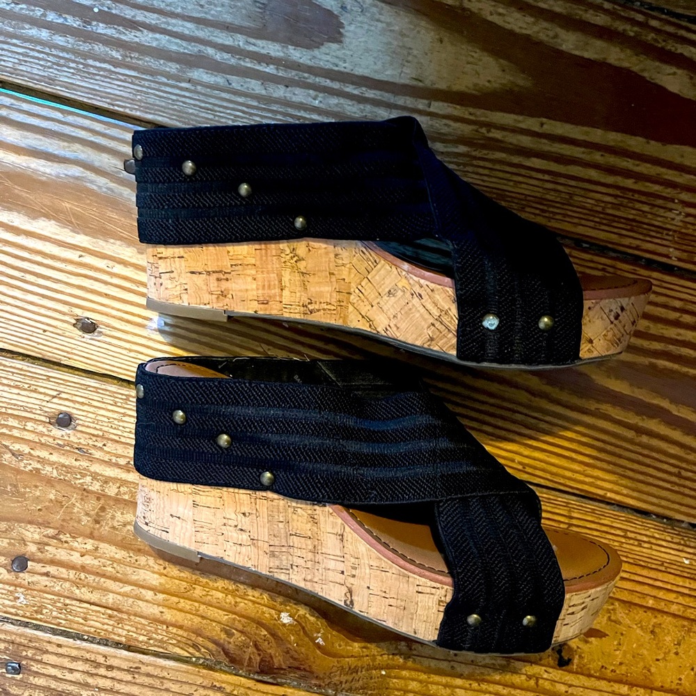 Crown black sandals.